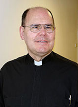 headshot of Msgr. Foster