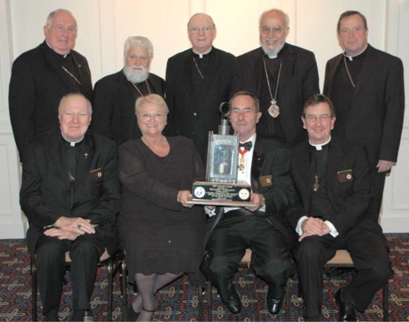Geraldine Studelmann seated with Knights and award